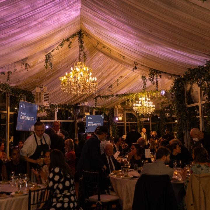 indoor reception with chandelier and people