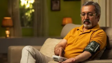 Man checking blood pressure with cuff