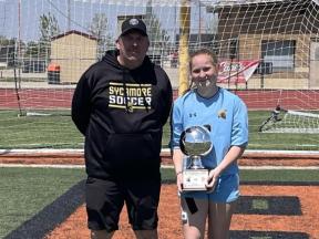 Photo of Brooke holding a trophy
