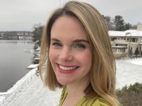 Portrait of a woman outside in snowy weather.