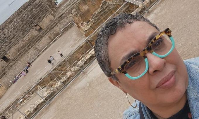 Photo of Maria in front of historic site