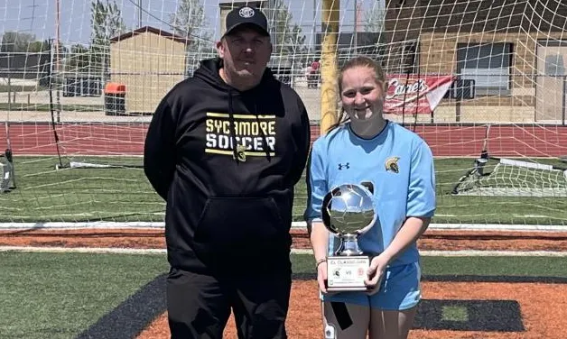 Photo of Brooke holding a trophy