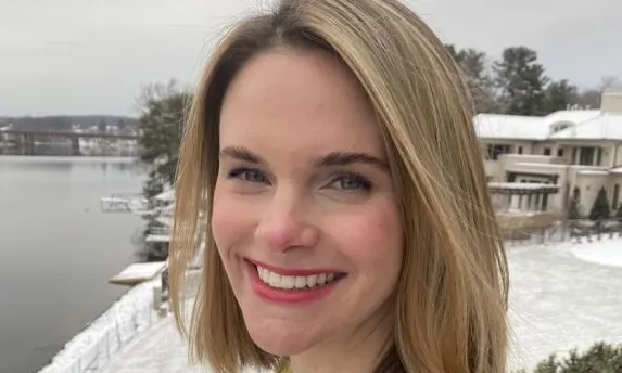 Portrait of a woman outside in snowy weather.