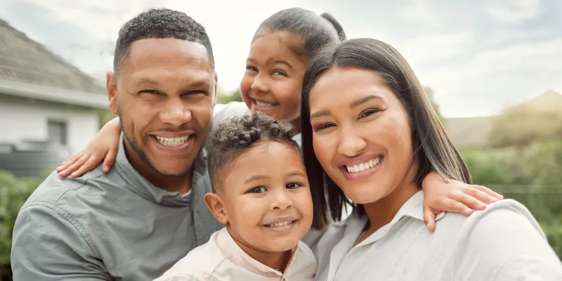 Smiling African American husband, wife, and children