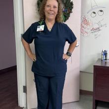 Photo of Marlena standing in a Nurse's uniform