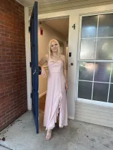 Photo of woman standing in a doorway
