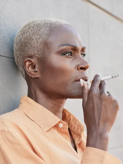 Mature-african-woman-smoking-a-cigarette
