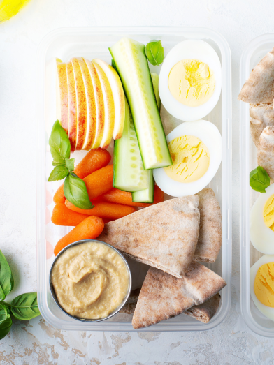Two containers filled with healthy snacks for a diabetic friendly diet