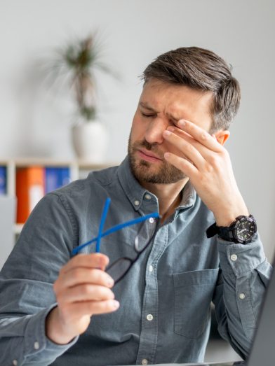 A man rubs at his dry eyes caused by diabetes related dry eye syndrome